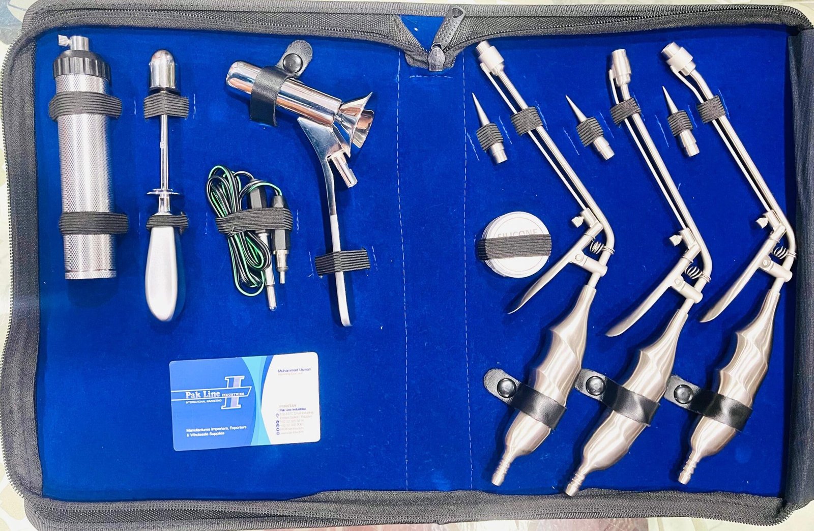 McGivney Hemorrhoidal Ligator Set with Kelly Proctoscope presented in blue padded case, stainless steel proctology surgical instruments.